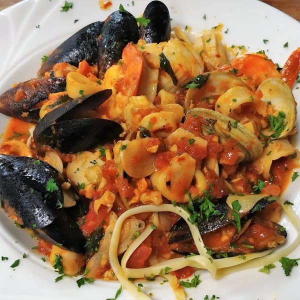 Mama Nina's seafood pasta with mussels, clams, shrimp, and calamari in a red sauce.